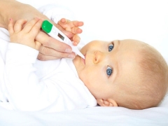 What should I do if my child’s temperature rises after vaccination?