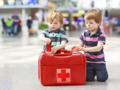 The first-aid kit for the child in a trip to the sea