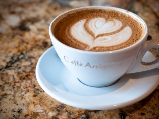 Cappuccino coffee with foam and heart pattern