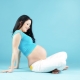 What poses will help ease the process of labor?