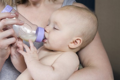 Baby is drinking from the bottle