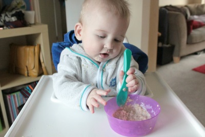 Baby eating porridge