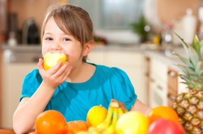 Girl eating fruit