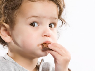 Child eating a chocolate bar