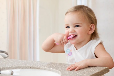 Baby brushing his teeth