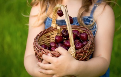 Girl eating cherry