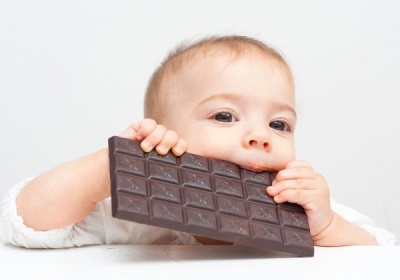 Child eating a chocolate bar