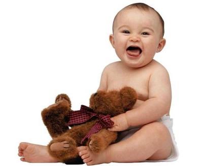 Baby screaming, sitting with a toy