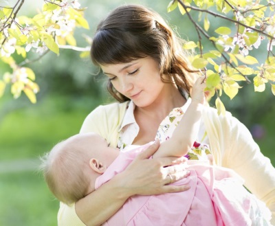 Baby mom breastfeeds at 11 months