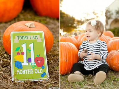 Baby 11 months old sitting on grass with pumpkins outside