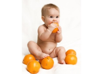 Baby bites orange peel