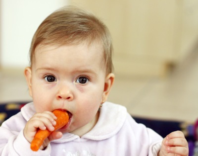 Baby eats carrots