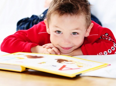 Child 4 years old with a book