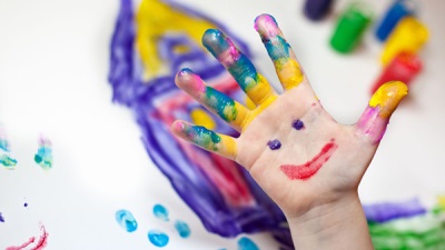 Drawing on the hands of a child