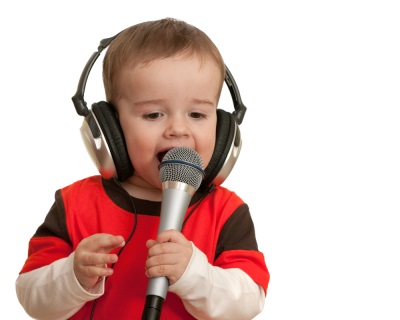 Baby sings into microphone