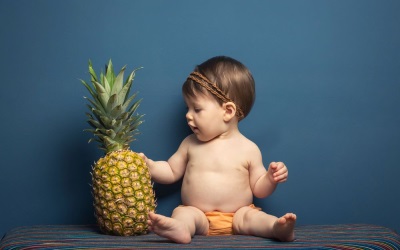 Child with pineapple