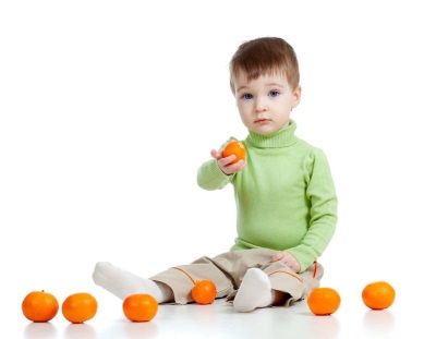 Boy with tangerines