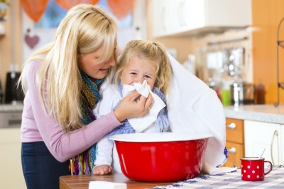 Home inhalation for a child with a basin or pan