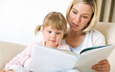 Mom and baby are reading a book