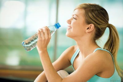 Teen girl drinks water