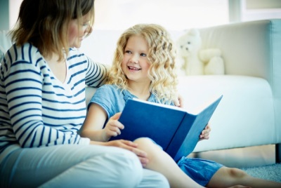 Mom and child are reading a book