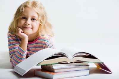 Child behind books