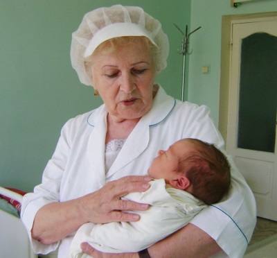 Newborn in the hospital at the midwife