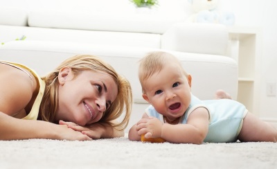 The development of the skill of holding the head of the baby