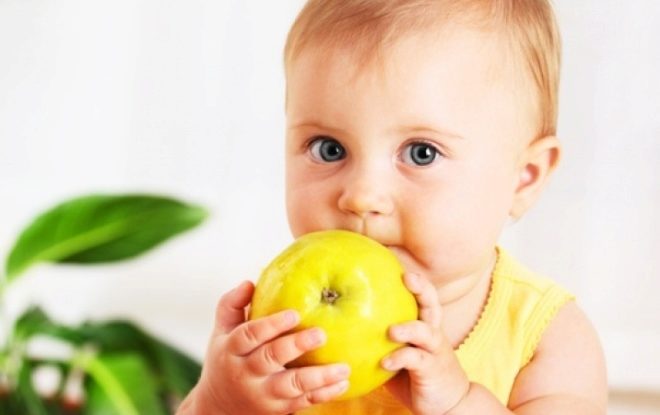 Child 2 years old with an apple