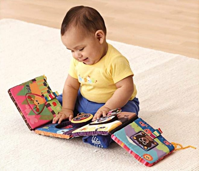 A child is looking at a tissue book.